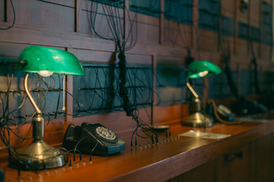 Old telephone connection headquarters - working place with telephone and lamps 