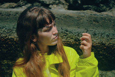 Portrait of young woman looking away