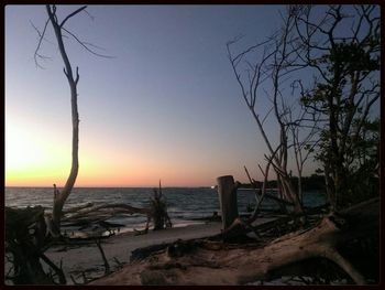 Scenic view of sea at sunset