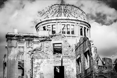 Old abandoned building against sky