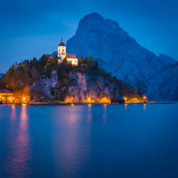 Illuminated buildings at waterfront