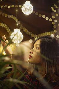 Portrait of woman with illuminated lights