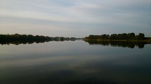 Scenic view of calm lake against sky