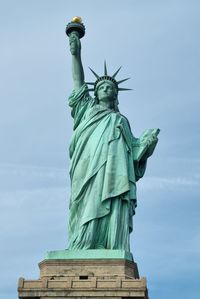 Low angle view of statue against sky