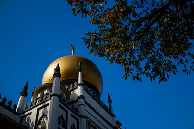 Low angle view of church against clear blue sky