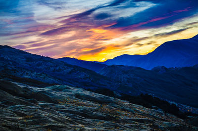 Scenic view of mountains against sky during sunset