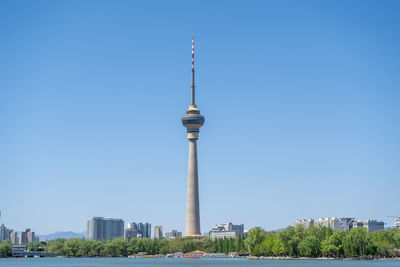Low angle view of beijing tv tower against clear blue sky