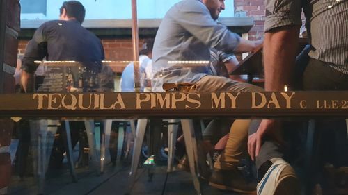 Low section of people standing in city