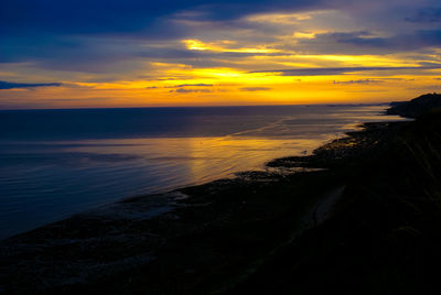 Scenic view of sea against sky during sunset