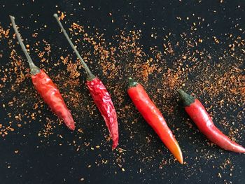 High angle view of red chili peppers on table