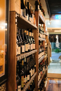 Close-up of wine bottles in a cozy cafe wine bar