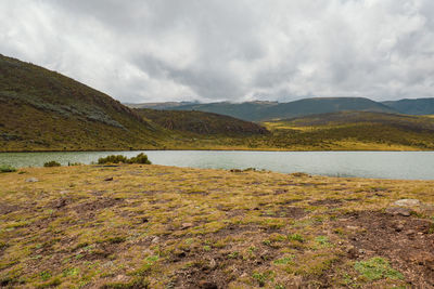 Scenic view of lake ellis against mountains in chogoria route, mount kenya national park, kenya