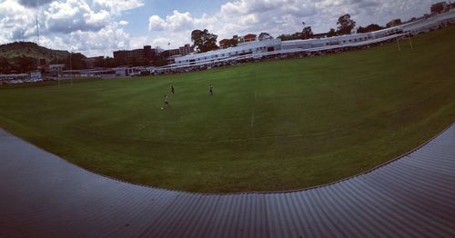 High angle view of soccer field against sky