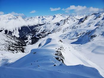 Scenic view of snowcapped mountains against sky