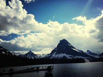 Scenic view of mountains against cloudy sky