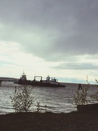 Scenic view of sea against cloudy sky