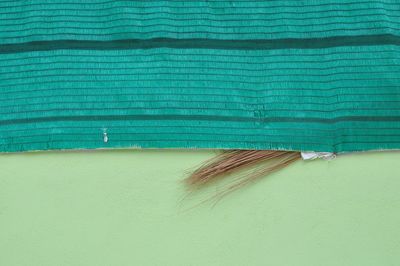 High angle view of broom and textile on floor