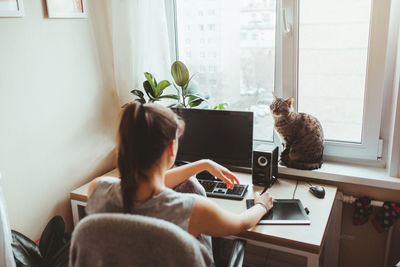 Man sitting on table at home