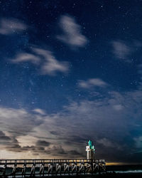 Built structure against sky at night