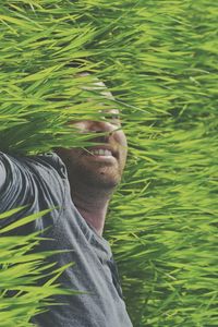 Portrait of man with plants