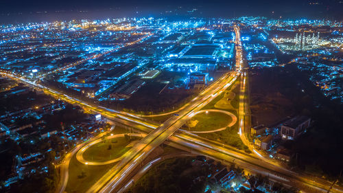 High angle view of illuminated cityscape at night