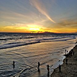 Scenic view of beach against sky during sunset