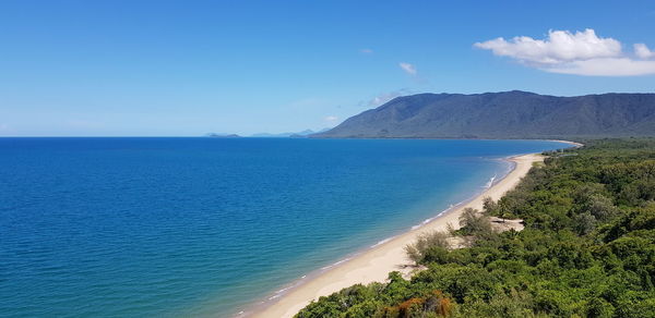 Scenic view of sea against blue sky