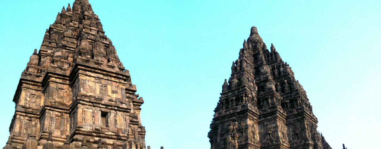 low angle view, clear sky, religion, architecture, famous place, blue, history, built structure, place of worship, building exterior, spirituality, travel destinations, travel, international landmark, ancient, tourism, copy space, day, ancient civilization, sky