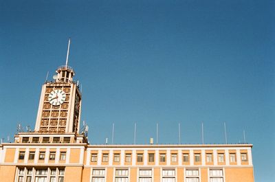 Low angle view of building against blue sky