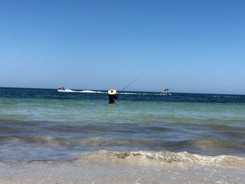 Scenic view of sea against clear sky