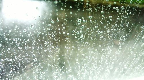 Full frame shot of wet glass during rainy season