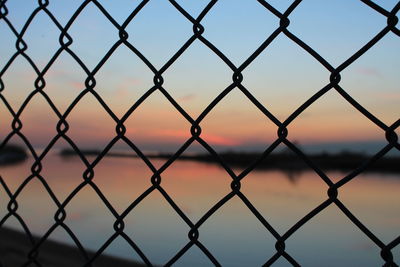 Chainlink fence seen through chainlink fence