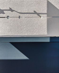 High angle view of shadow on wall