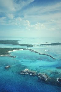 Scenic view of sea against blue sky