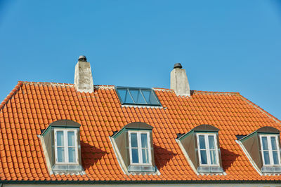 Low angle view of building against clear blue sky