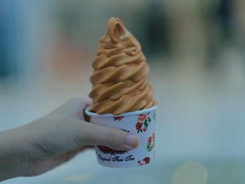 Hand holding ice cream cone