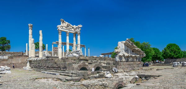 Ruins of temple against clear blue sky