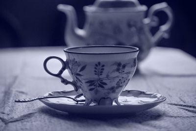 Close-up of coffee cup on table