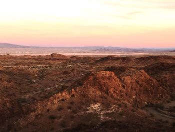 Scenic view of landscape at sunset