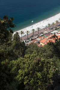 High angle view of townscape by sea