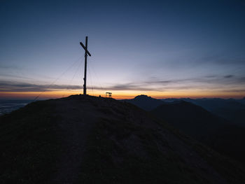 Scenic view of silhouette mountains against sky during sunset