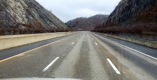 Empty road against sky