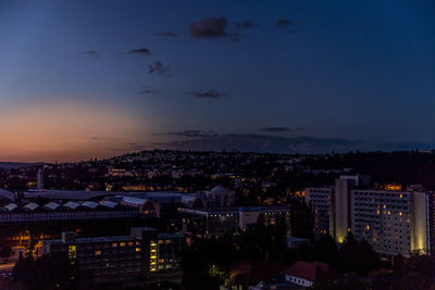 High angle view of illuminated buildings in city at night