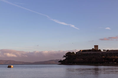 Scenic view of sea and building against sky