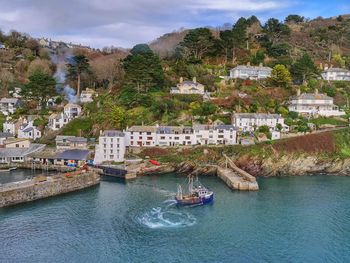 High angle view of townscape by sea