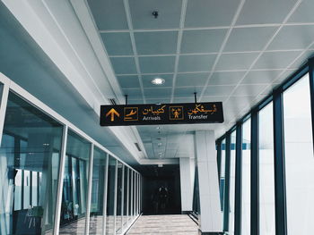 Low angle view of illuminated sign at airport