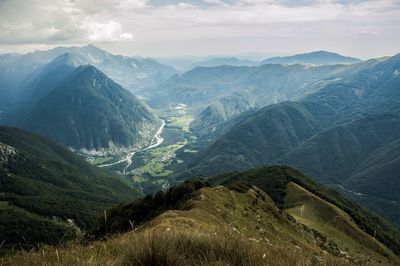 Scenic view of mountains against cloudy sky