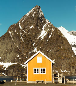 Scenic view of snowcapped mountains against clear blue sky