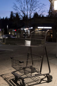 Empty parking lot by street at night