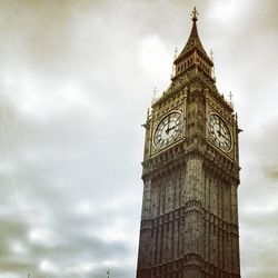 Low angle view of big ben against cloudy sky